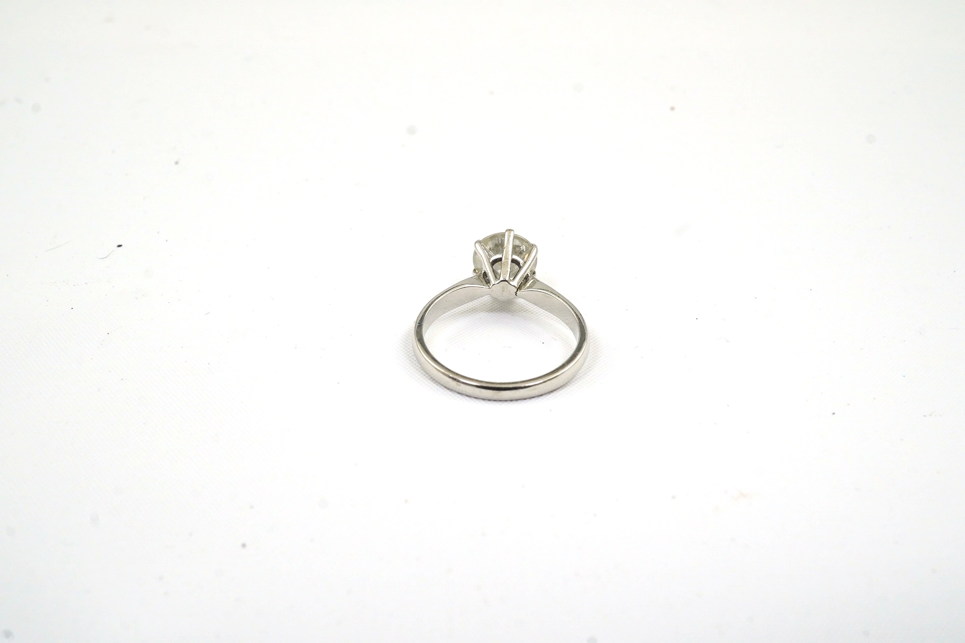 A modern 18ct white gold and solitaire diamond set ring